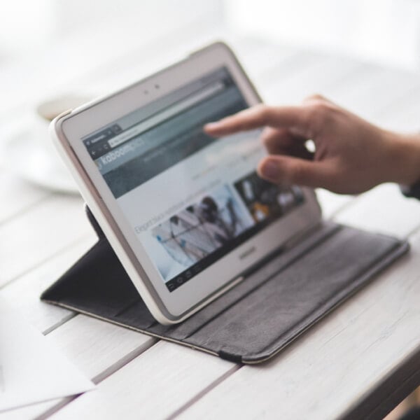 View of a Hand navigating on a tablet